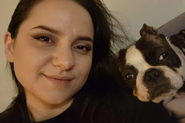 A photo of Autumn Mitchell and her dog.